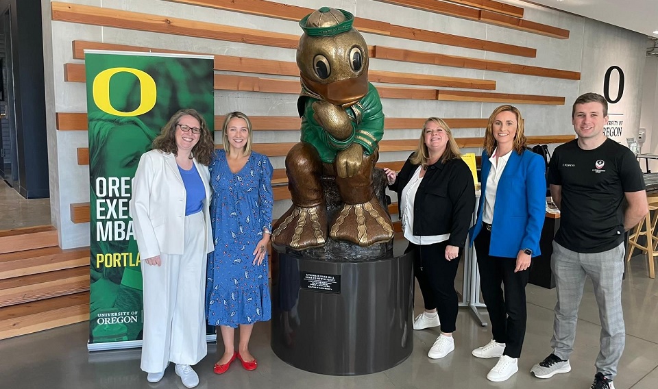 Lily Rumsey, Loughborough's Director of Global Engagement, and Professor Jo Maher, the University's Pro Vice-Chancellor for Sport, are pictured with colleagues from the University of Oregon next to a statue of the Oregon mascot.